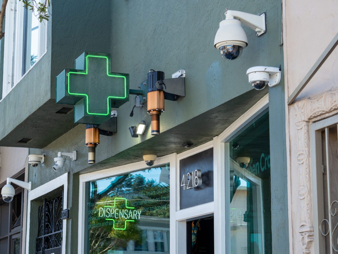 Green cross sign at dispensary entrance