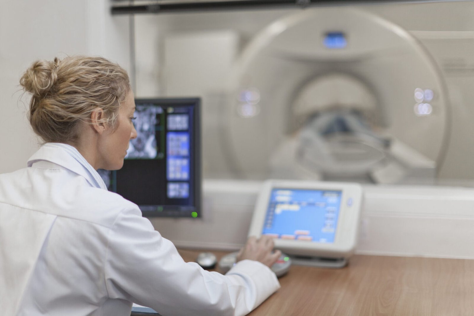 Medical professional at MRI control panel