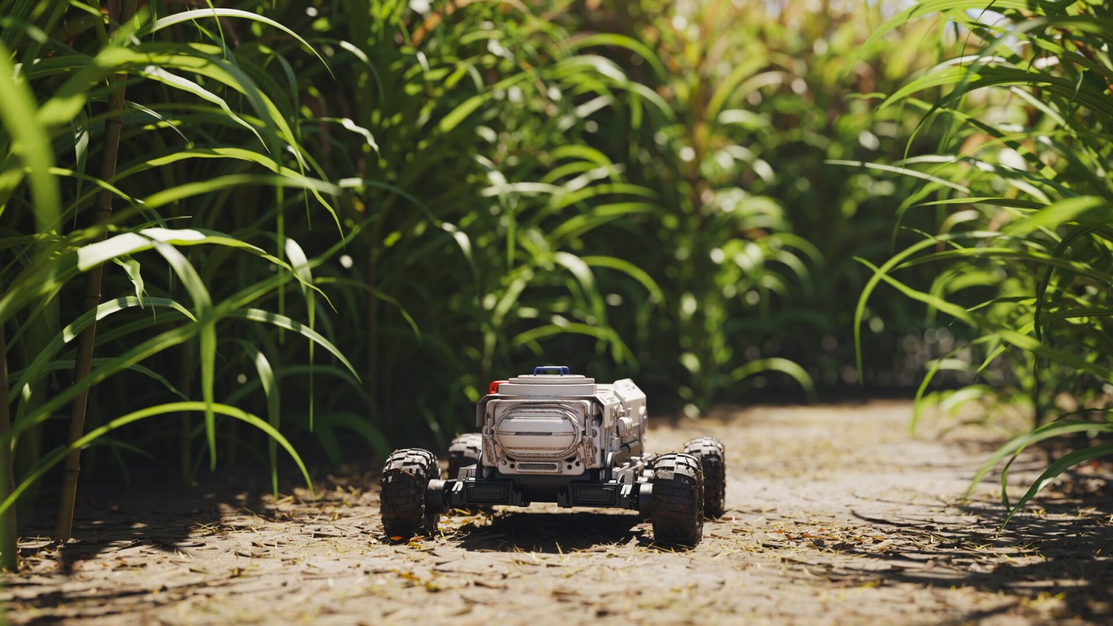 Small robot driving in agricultural setting.