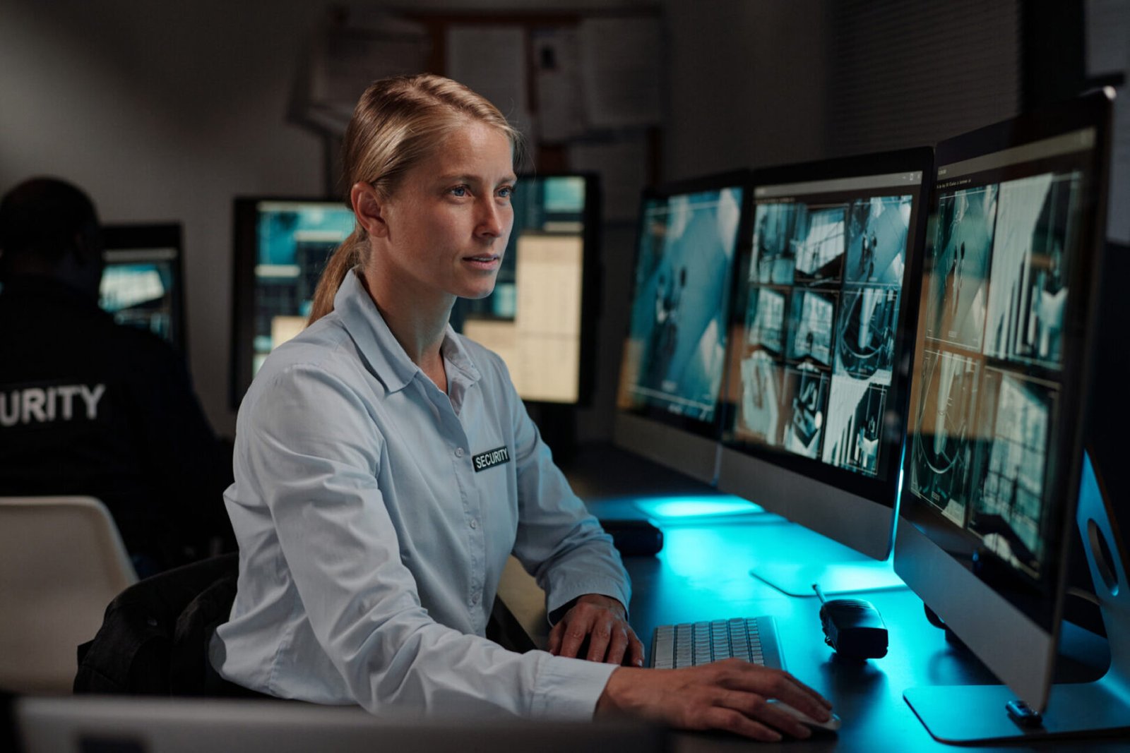 Security officer at surveillance workstation