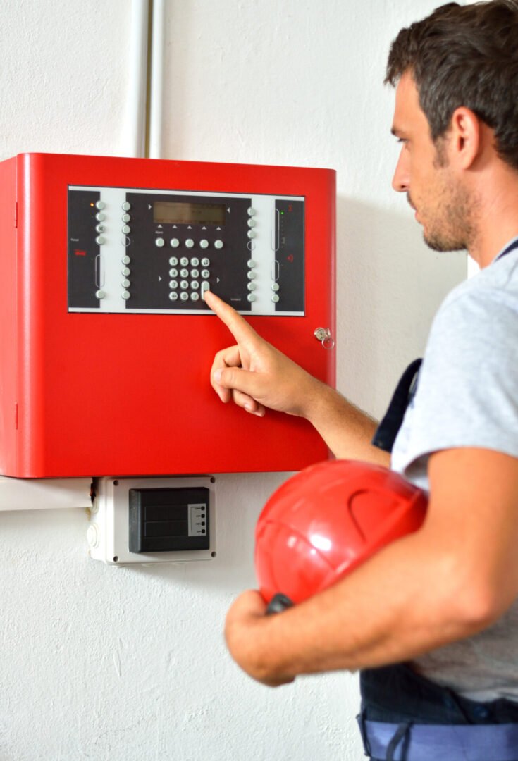 Man adjusting security system settings