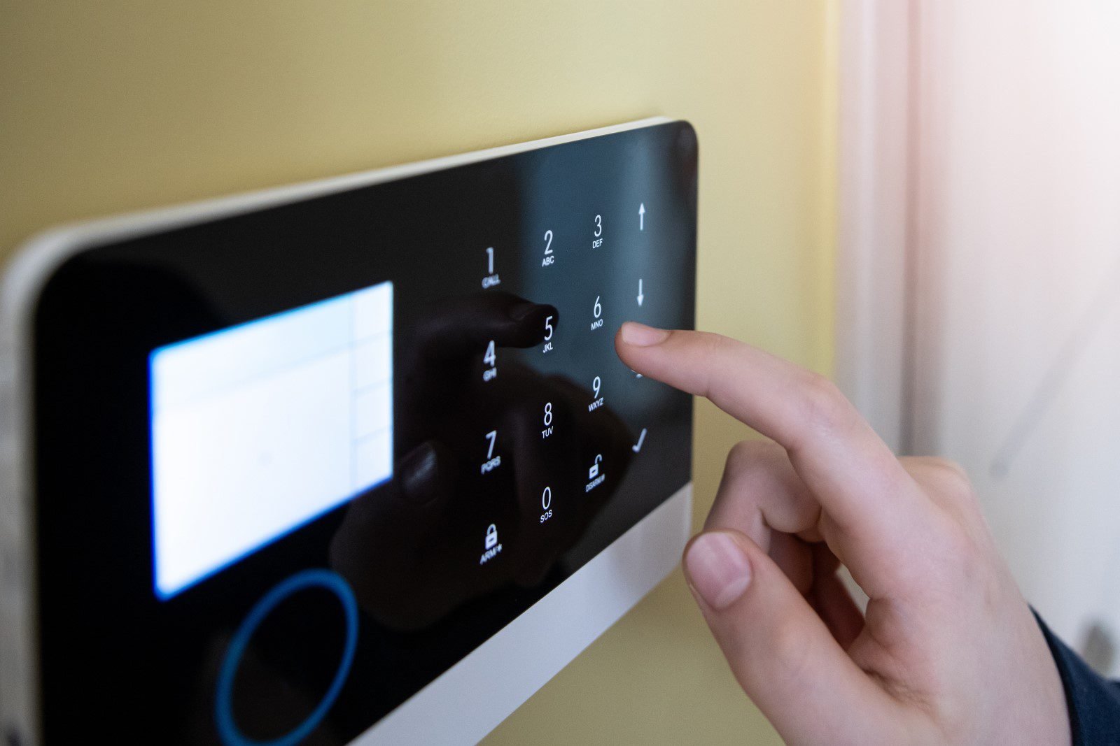 Hand interacting with digital keypad