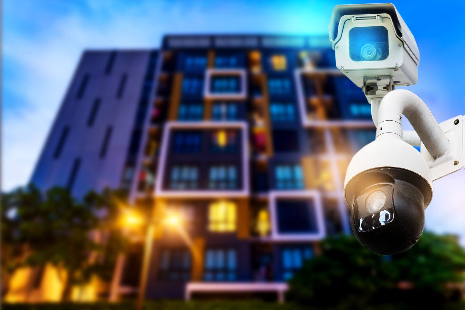 Security cameras monitoring modern building exterior